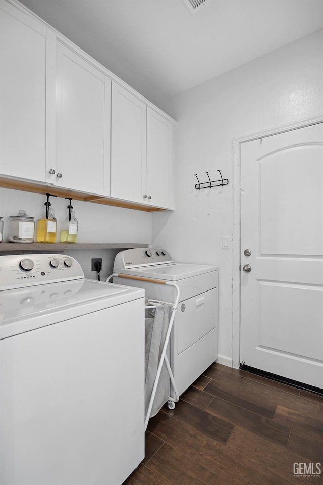 3116 Seymour St, Tulare, CA 93274 - washroom featuring washer and clothes dryer, cabinet space, and dark wood-style floors