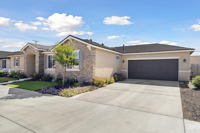 3116 Seymour St, Tulare, CA 93274 - ranch-style home featuring stone siding, stucco siding, a garage, and concrete driveway