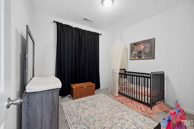 3116 Seymour St, Tulare, CA 93274 - carpeted bedroom with a crib and baseboards