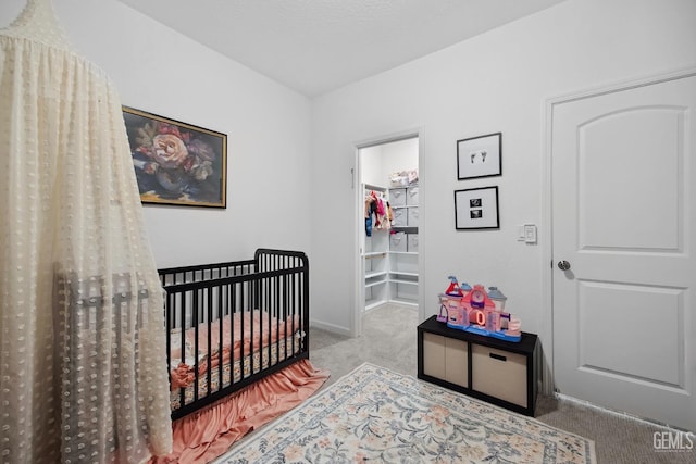 3116 Seymour St, Tulare, CA 93274 - carpeted bedroom featuring a nursery area and baseboards