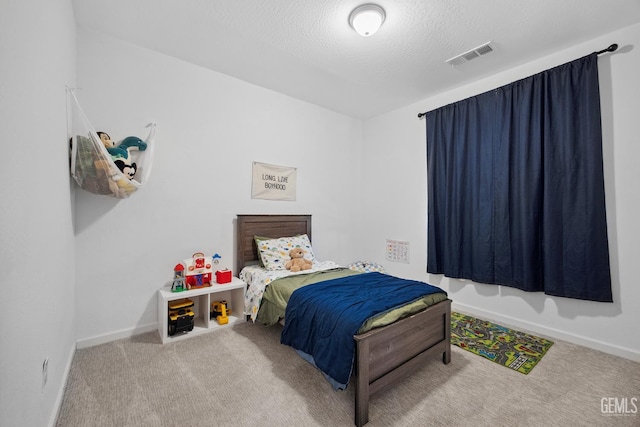 3116 Seymour St, Tulare, CA 93274 - carpeted bedroom featuring baseboards and a textured ceiling