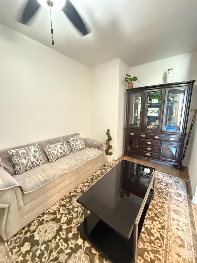 living room with hardwood / wood-style flooring and ceiling fan