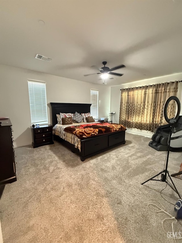 carpeted bedroom with ceiling fan