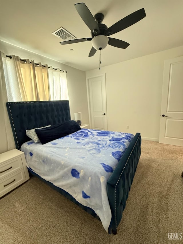 carpeted bedroom featuring ceiling fan