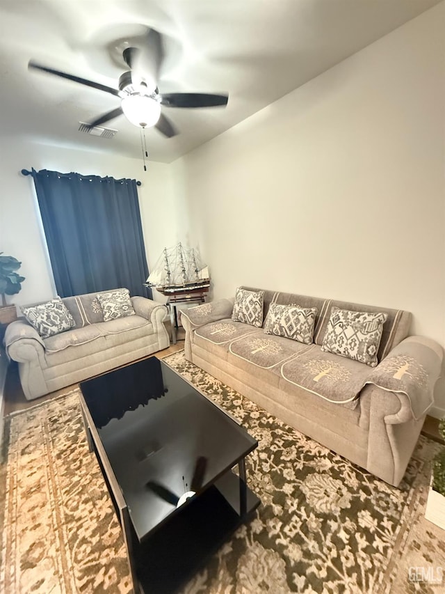 living room featuring ceiling fan