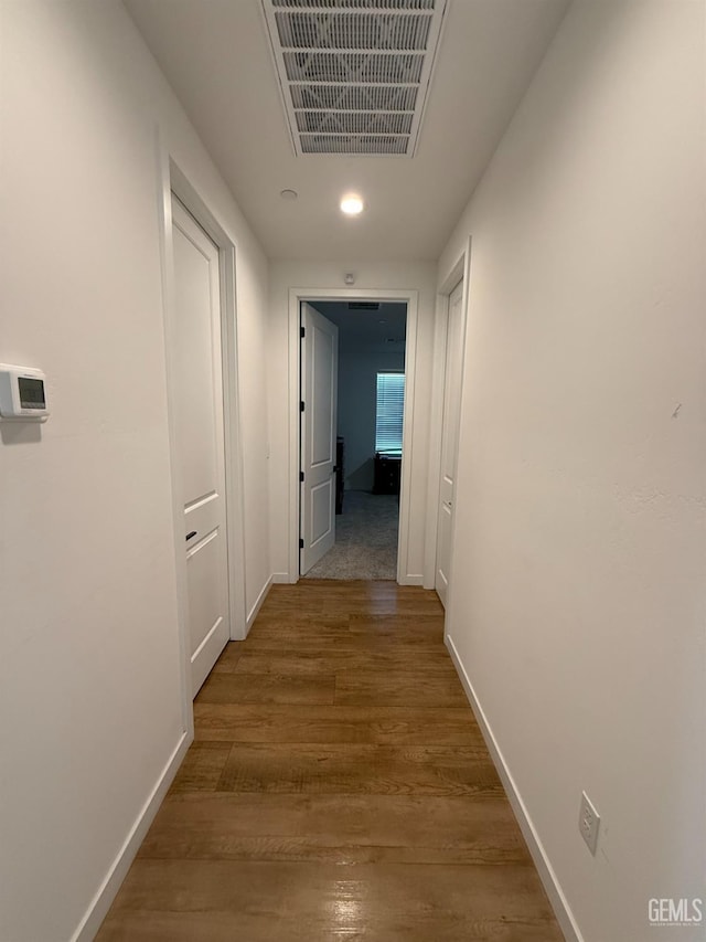 hallway featuring hardwood / wood-style floors