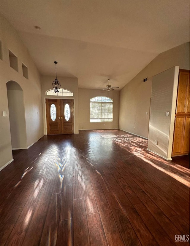 entrance foyer featuring vaulted ceiling, ceiling fan, and dark wood-type flooring