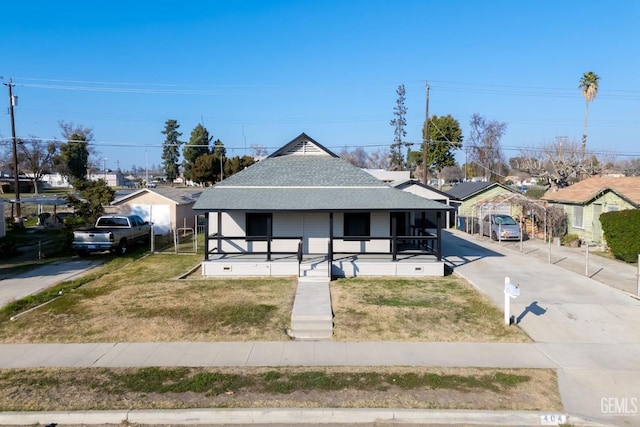 view of front facade with a front yard and a porch