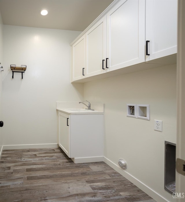 laundry room with wood finished floors, baseboards, cabinet space, recessed lighting, and washer hookup