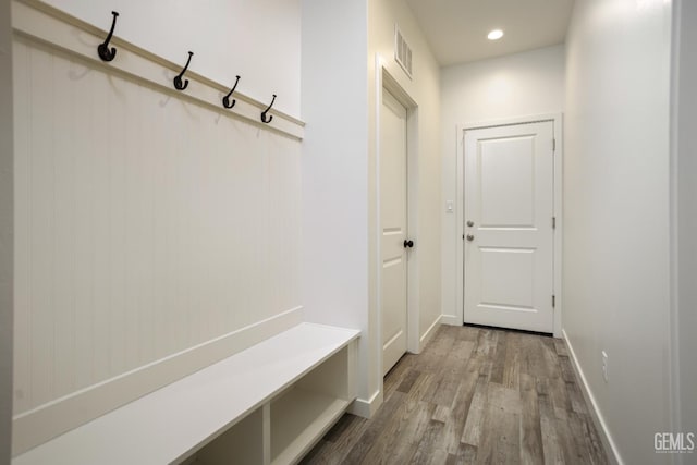 mudroom featuring wood finished floors, baseboards, and recessed lighting