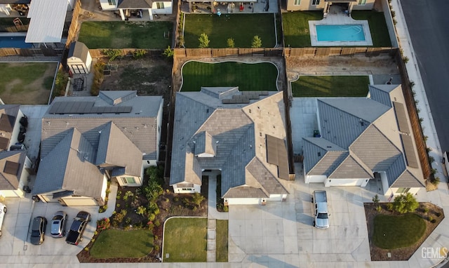 aerial view of residential area featuring a pool area