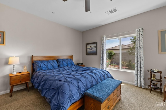 bedroom featuring baseboards, a ceiling fan, visible vents, and carpet floors