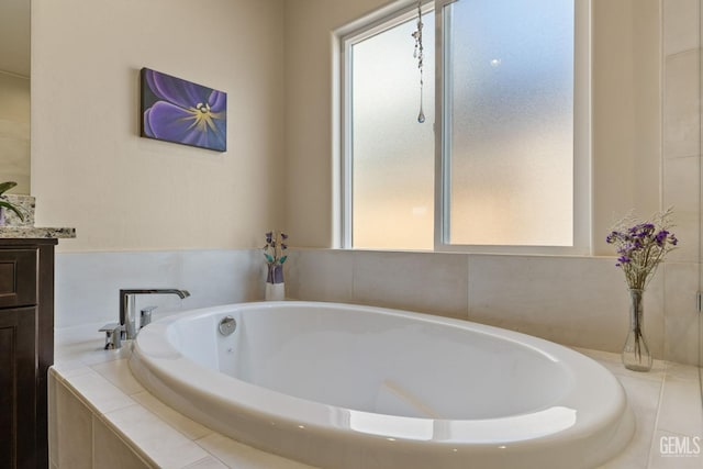 full bath with a garden tub and vanity