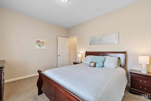 bedroom featuring carpet floors and baseboards