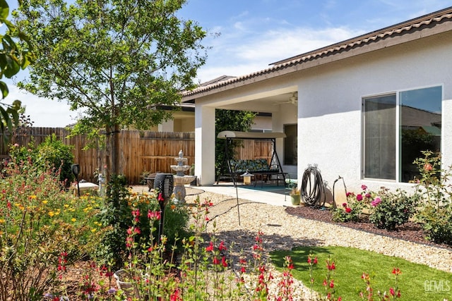 view of yard with fence and a patio