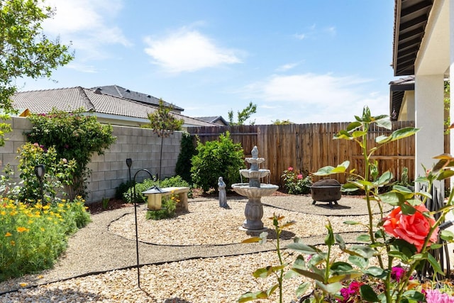 view of yard with a fenced backyard and a patio