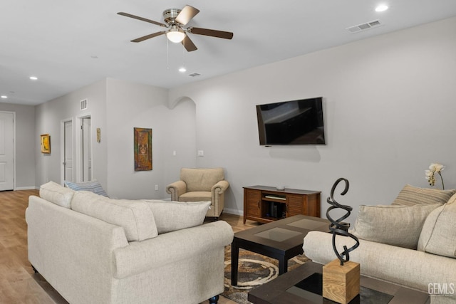 living area with ceiling fan, light wood-type flooring, visible vents, and recessed lighting