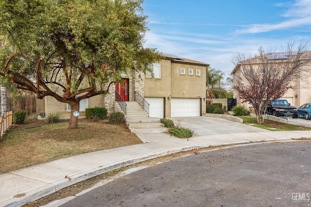 408 Brite Meadow Ct, Bakersfield, CA 93308 - view of front of house featuring stucco siding, a garage, and driveway