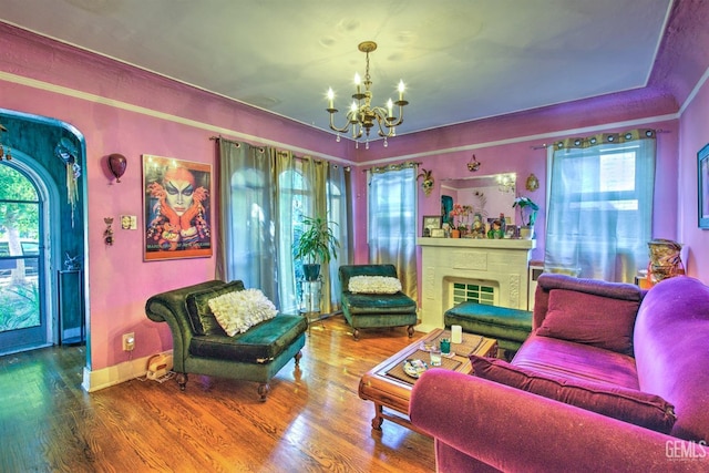 512 N Harper Ave, Los Angeles, CA 90048 - living area featuring a chandelier, wood finished floors, and a fireplace