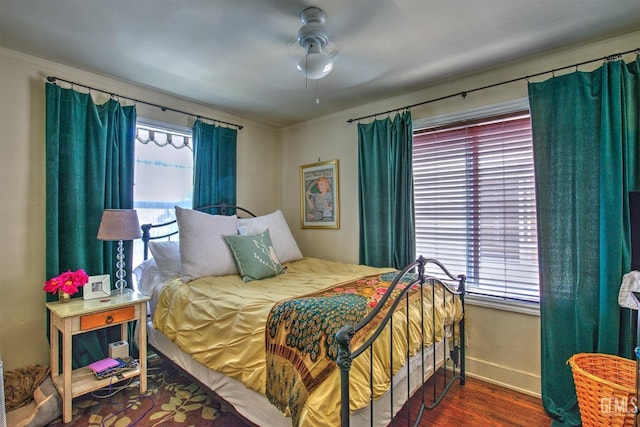 512 N Harper Ave, Los Angeles, CA 90048 - bedroom with multiple windows, wood finished floors, and ceiling fan