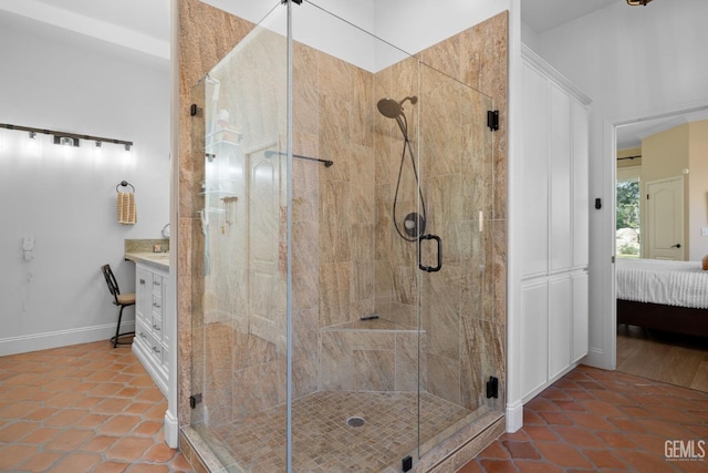 3121 Emerald Arbor St, Bakersfield, CA 93314 - ensuite bathroom with vanity, baseboards, a stall shower, tile patterned flooring, and connected bathroom