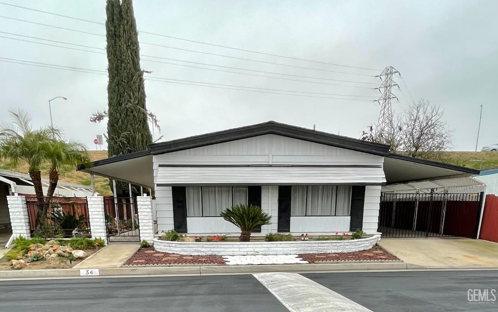 view of front of property with a carport