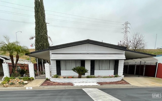 view of front of property with a carport