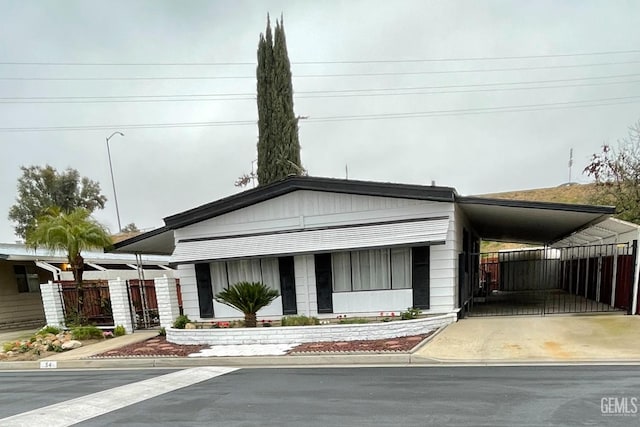 view of front facade with a carport