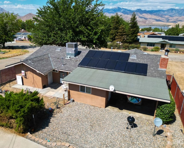 birds eye view of property with a mountain view