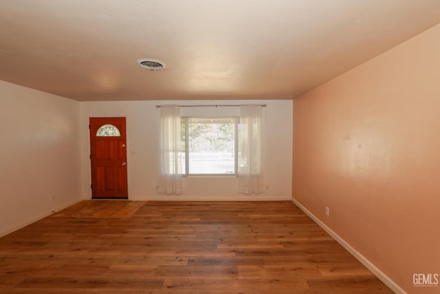 entryway with wood-type flooring