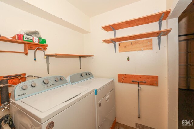 laundry room featuring separate washer and dryer