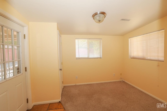 unfurnished room with carpet