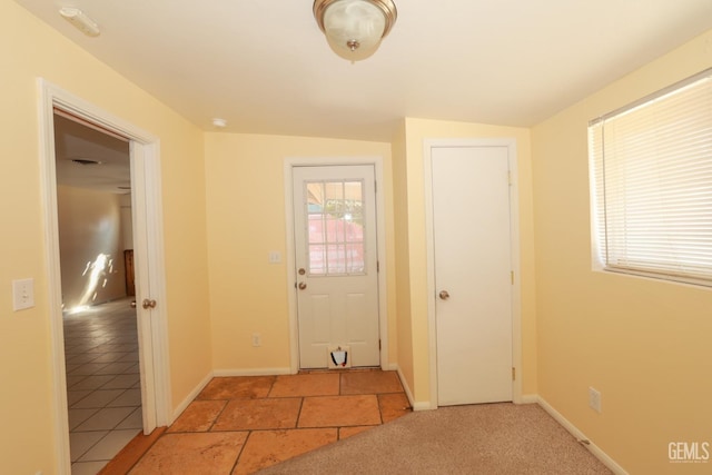 foyer featuring plenty of natural light and lofted ceiling