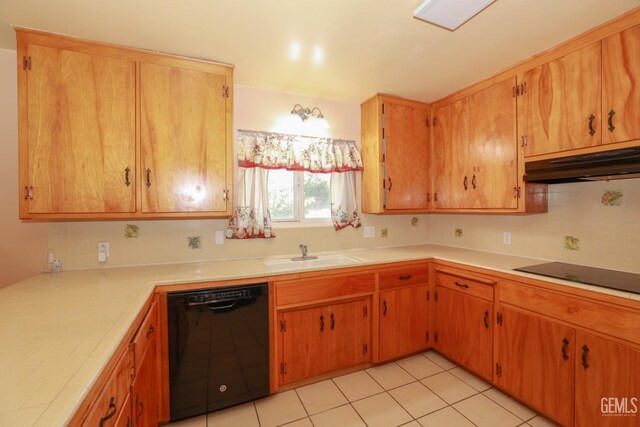 kitchen featuring tile counters, sink, tasteful backsplash, light tile patterned flooring, and black appliances