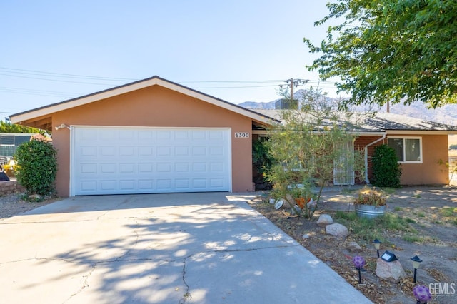 single story home featuring a garage