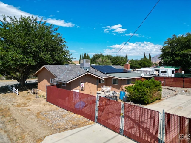 view of front of home with solar panels