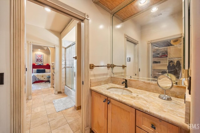 4905 Islands Dr, Bakersfield, CA 93312 - ensuite bathroom with vanity, tile patterned flooring, shower / bath combination with glass door, and recessed lighting