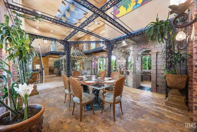 4905 Islands Dr, Bakersfield, CA 93312 - dining room with coffered ceiling, ornate columns, a high ceiling, and beamed ceiling