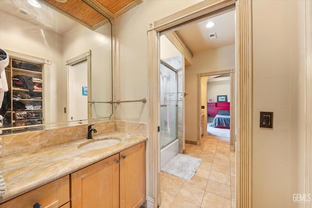 4905 Islands Dr, Bakersfield, CA 93312 - full bathroom with vanity, tile patterned floors, ensuite bathroom, and shower / bath combination with glass door