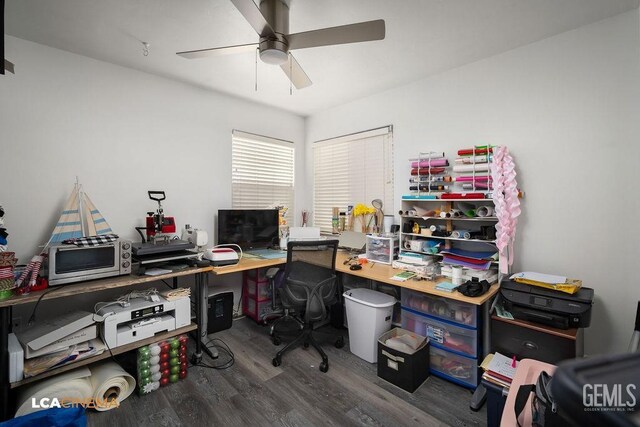 office space with a ceiling fan and wood finished floors