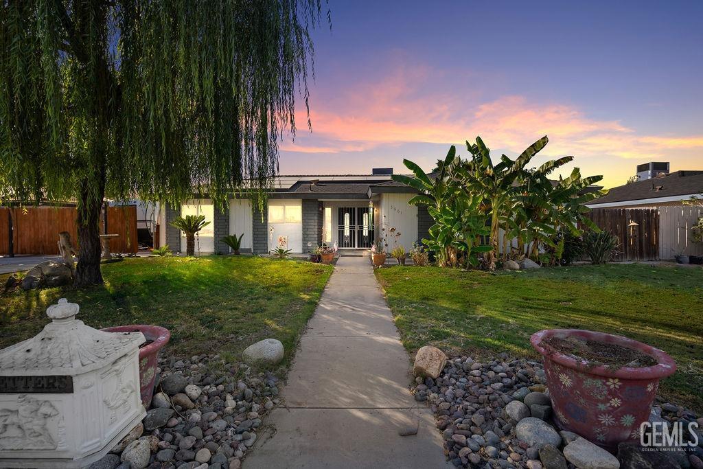 view of front of home with a lawn