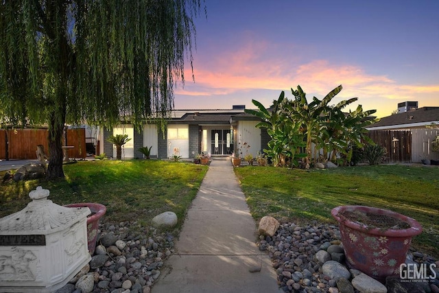 view of front of home with a lawn