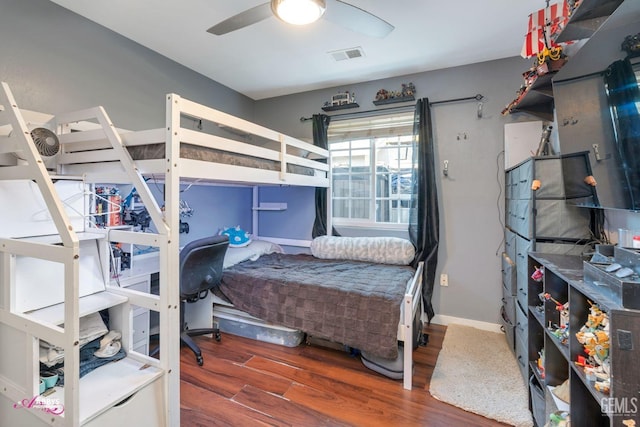 bedroom featuring ceiling fan and dark hardwood / wood-style floors