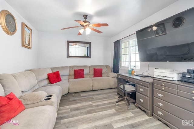 living room with ceiling fan and light hardwood / wood-style floors