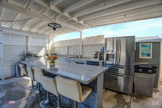 view of patio / terrace with an outdoor wet bar