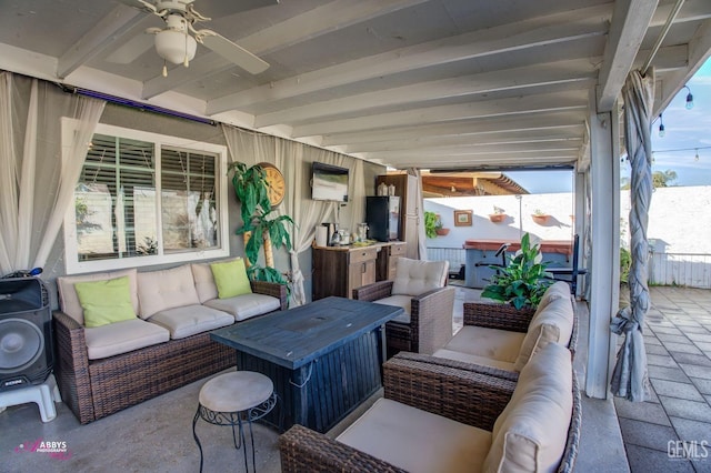 view of patio featuring an outdoor living space, a hot tub, and ceiling fan