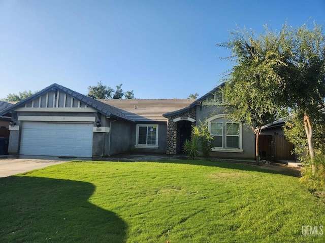 single story home featuring a garage and a front lawn