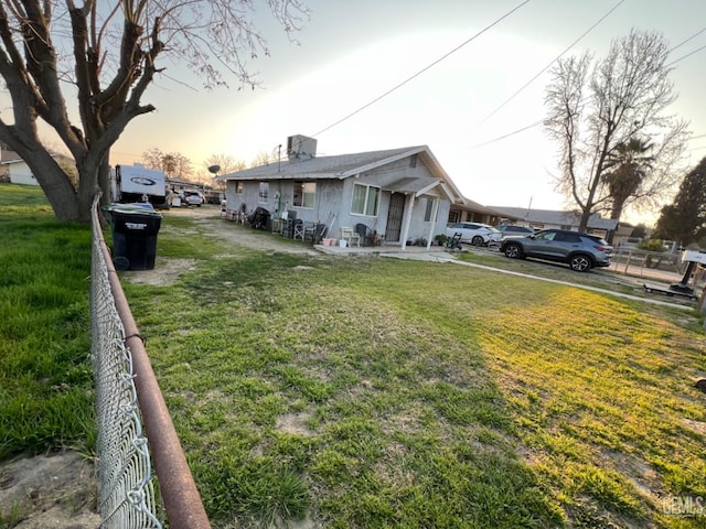 view of front of property with a lawn