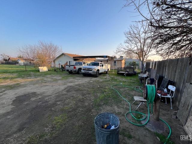 view of yard at dusk