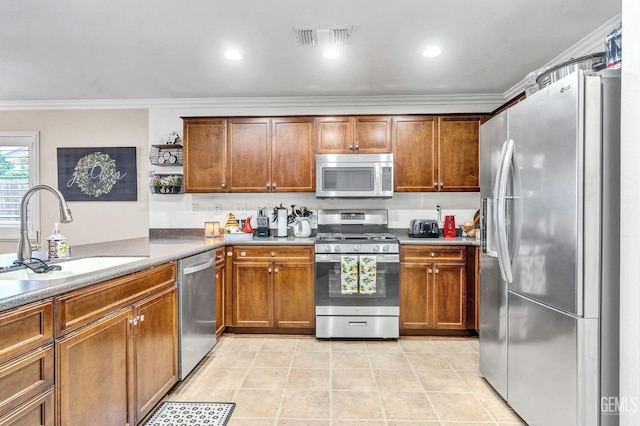 12503 Maclure Dr, Bakersfield, CA 93311 - kitchen featuring stainless steel appliances, crown molding, brown cabinets, light tile patterned floors, and light countertops